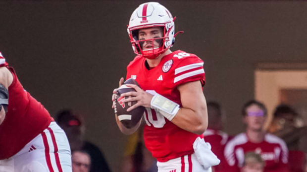 Nebraska Cornhuskers quarterback Henrich Haarberg attempts a pass during a college football game in the Big Ten.